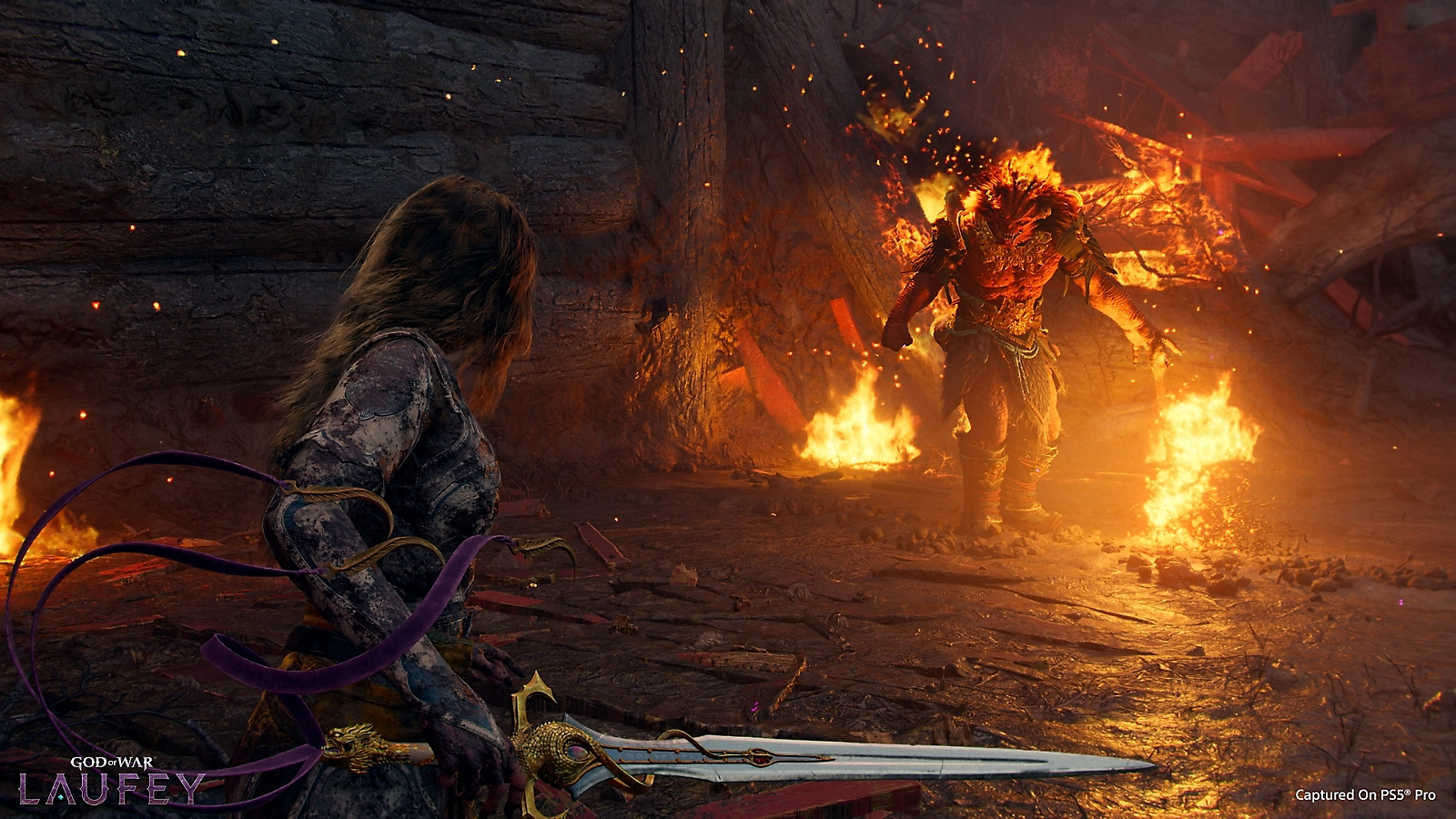 Laufey in battle against a towering enemy